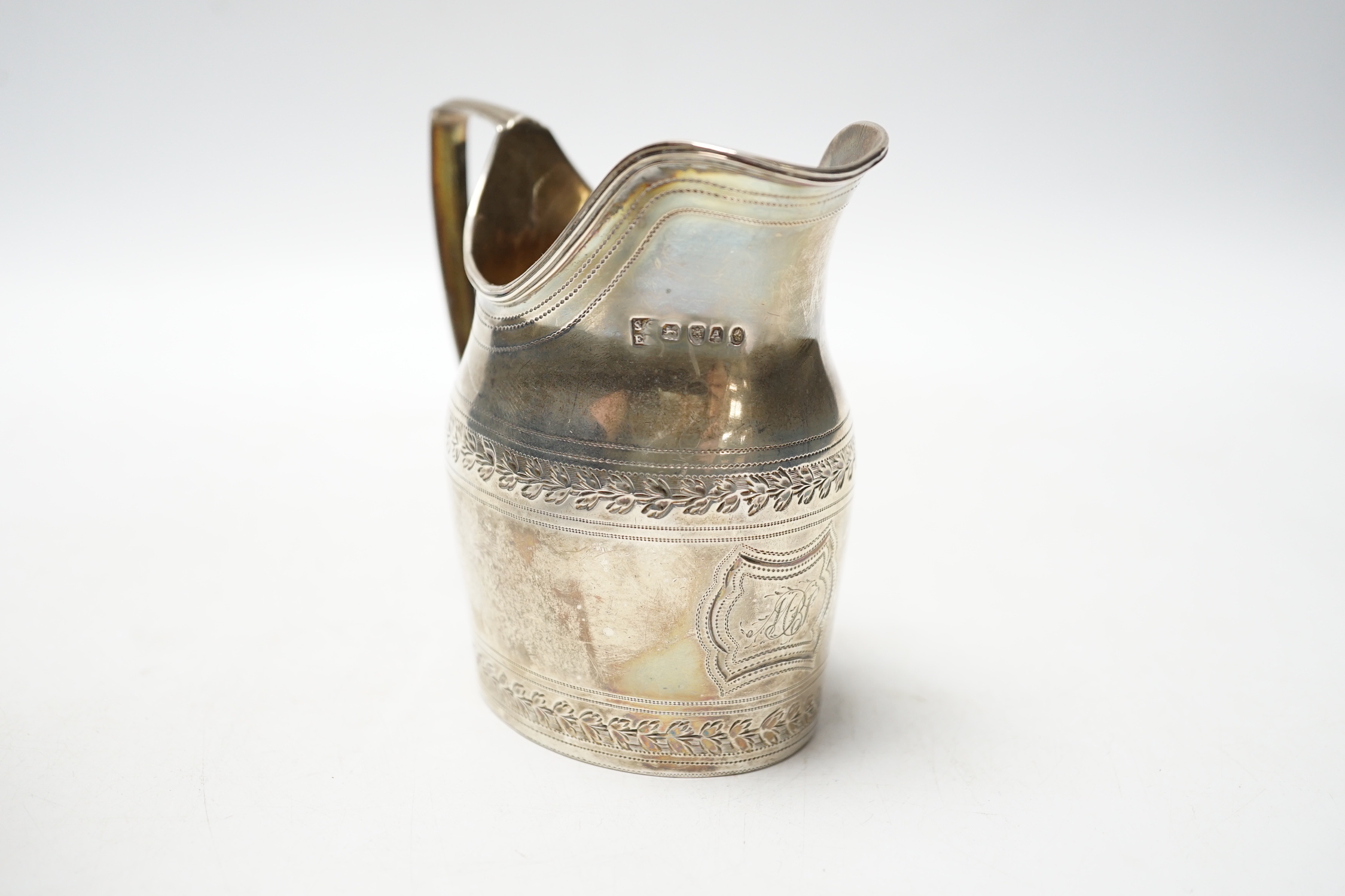 A George III silver engraved helmet shaped cream jug, Godbehere & Wigan, London, 1796, 10cm, 5.3oz.